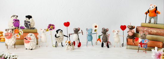 A group of handmade felt Tiny Animal ornaments by Sew Heart Felt, including mice and sheep with hobbies and professions